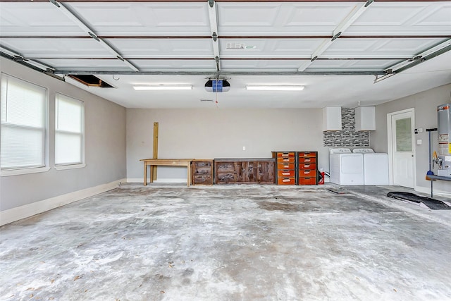 garage with washing machine and dryer and a garage door opener