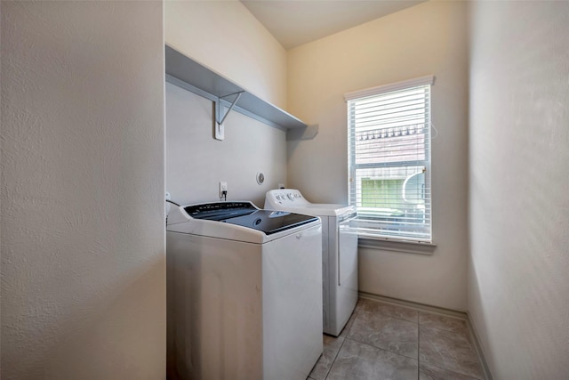 clothes washing area with washer and dryer