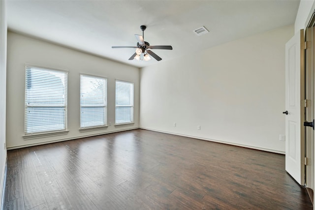 unfurnished room with ceiling fan and dark hardwood / wood-style floors