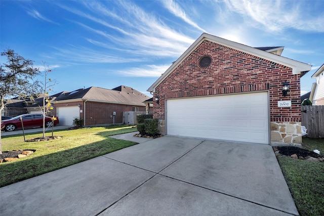 view of side of home featuring a lawn and a garage