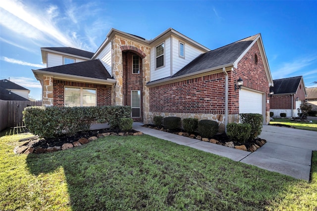 view of front of home featuring a front lawn and a garage