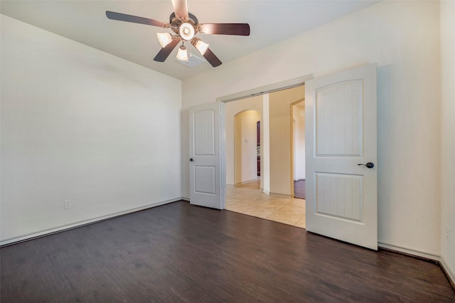 unfurnished room featuring ceiling fan and wood-type flooring