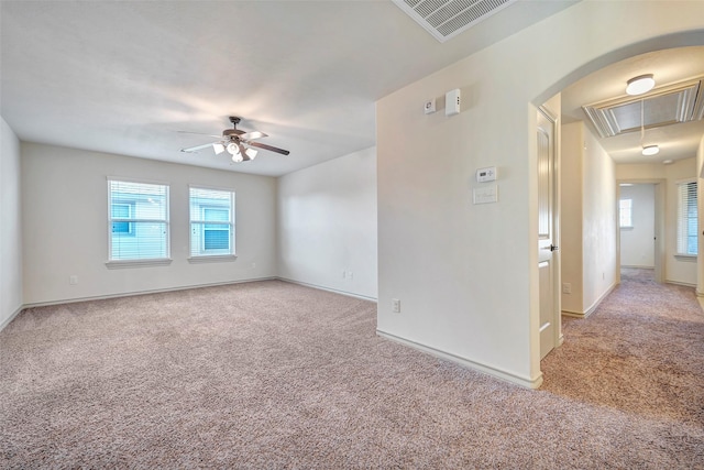 carpeted empty room featuring ceiling fan