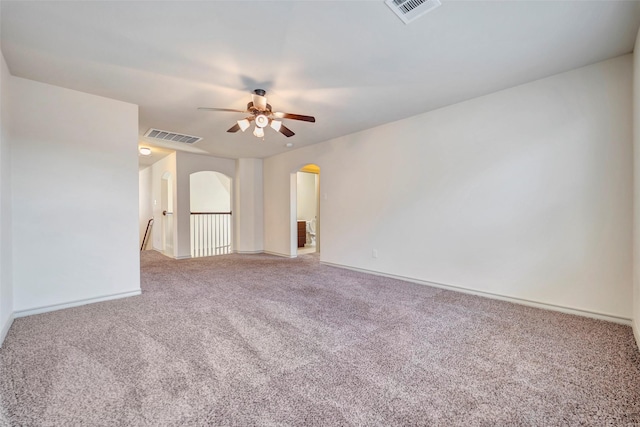 empty room with carpet floors and ceiling fan