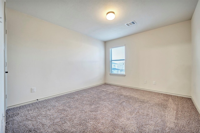 empty room featuring carpet floors