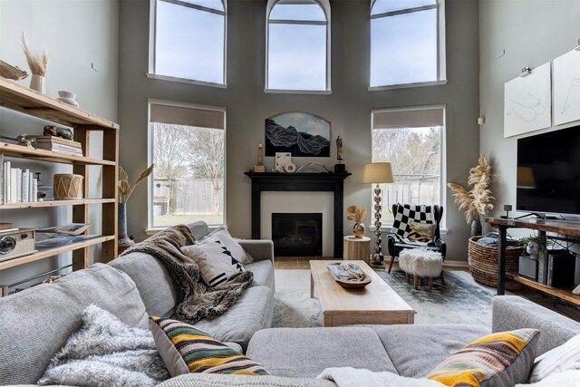 living room with a towering ceiling