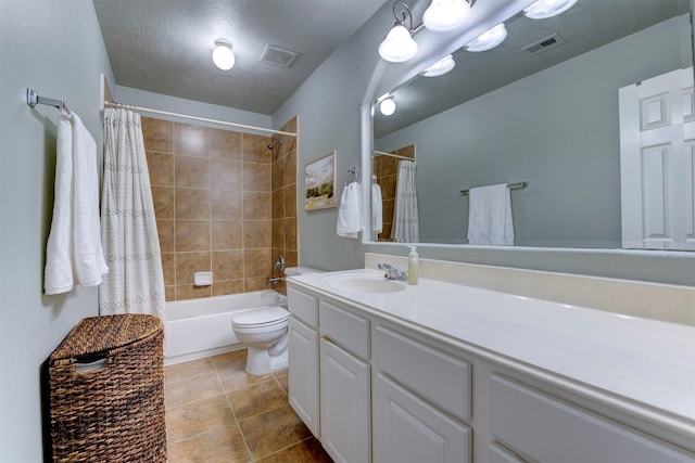 full bathroom featuring toilet, a textured ceiling, shower / bath combination with curtain, and vanity