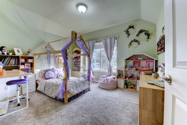 bedroom with carpet and vaulted ceiling