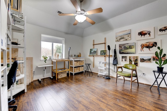 office area featuring dark wood-style flooring, visible vents, a ceiling fan, vaulted ceiling, and baseboards