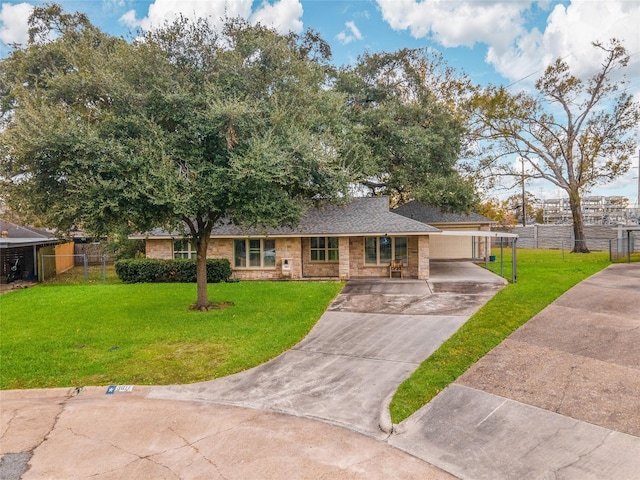 ranch-style home featuring a front lawn and a garage