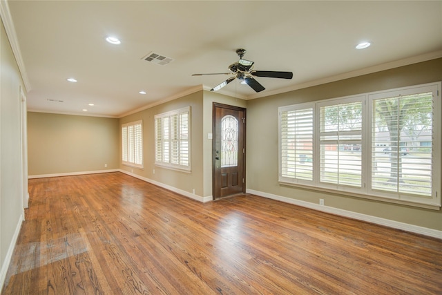 foyer featuring ceiling fan, hardwood / wood-style flooring, and ornamental molding