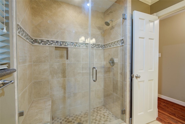 bathroom featuring walk in shower and hardwood / wood-style flooring