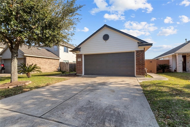 ranch-style house with a garage and a front yard