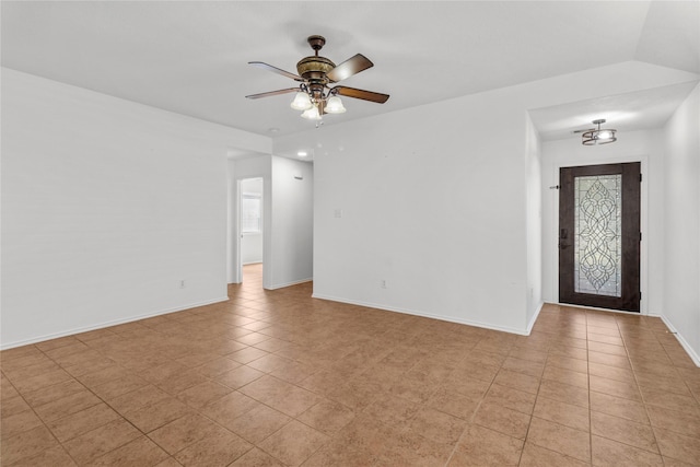 unfurnished room with light tile patterned flooring and ceiling fan