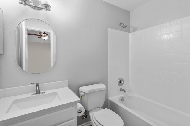 full bathroom featuring toilet, a textured ceiling, shower / bathing tub combination, ceiling fan, and vanity