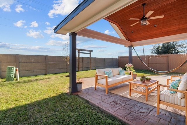 view of patio / terrace with ceiling fan and an outdoor living space