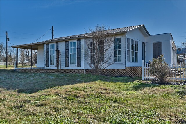 view of home's exterior featuring a lawn