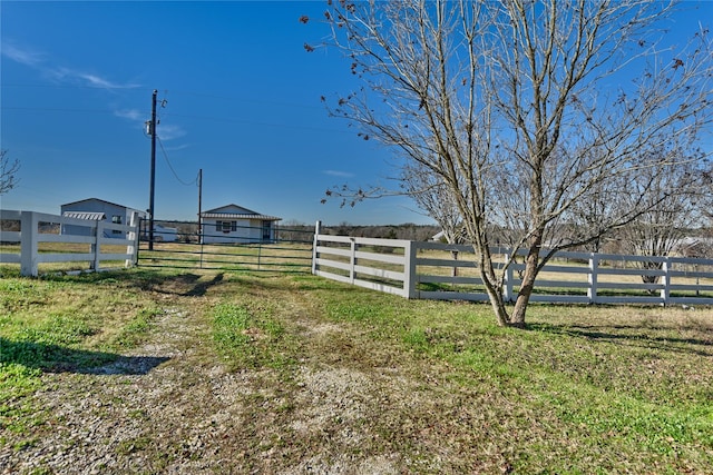 view of yard with a rural view