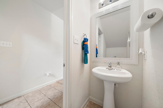 bathroom with tile patterned flooring