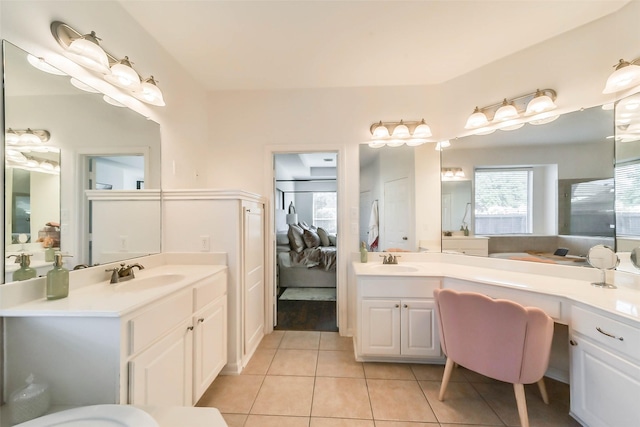 bathroom with tile patterned flooring and vanity