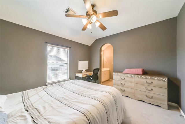 bedroom with ceiling fan, vaulted ceiling, and carpet floors