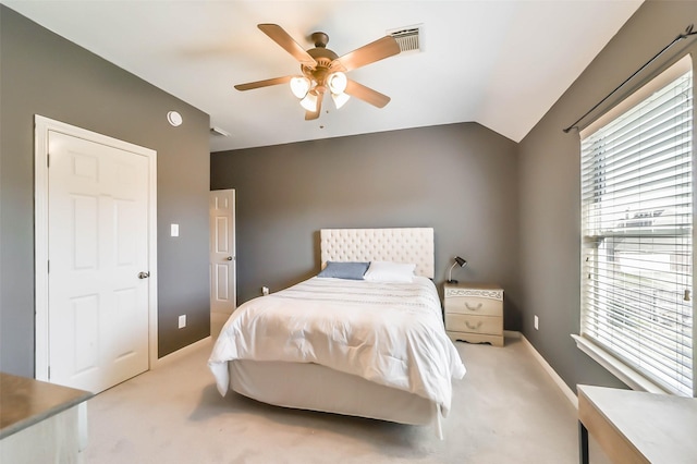 bedroom featuring lofted ceiling, carpet floors, and ceiling fan