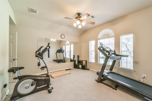 exercise area with lofted ceiling, carpet floors, and ceiling fan