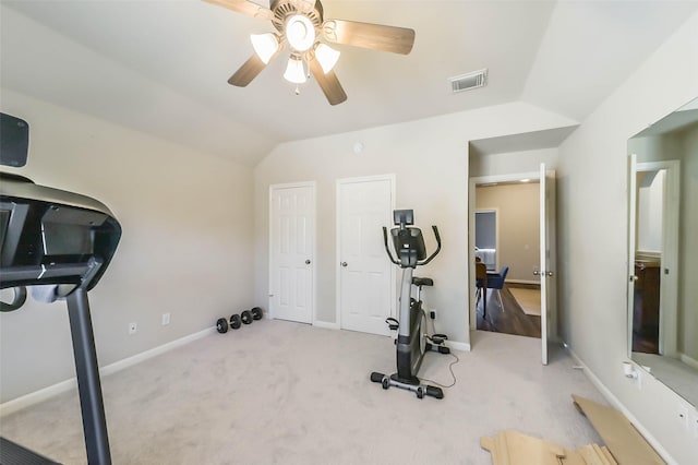 exercise area with light colored carpet, ceiling fan, and vaulted ceiling