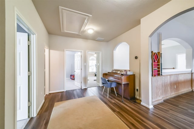 hallway with dark hardwood / wood-style floors