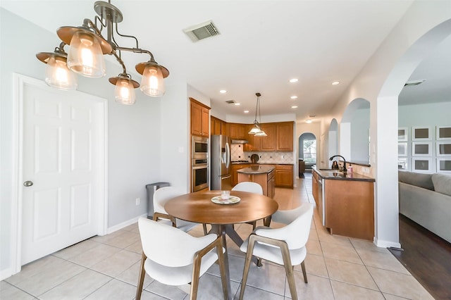 tiled dining space with sink