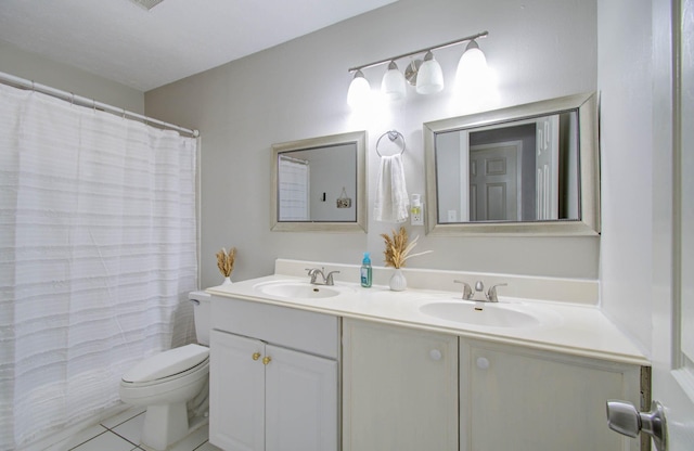 bathroom with toilet, vanity, tile patterned floors, and a shower with curtain