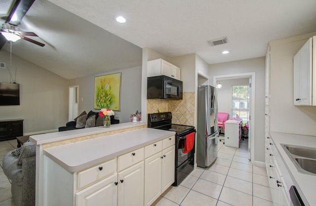 kitchen with light tile patterned floors, white cabinets, decorative backsplash, and black appliances