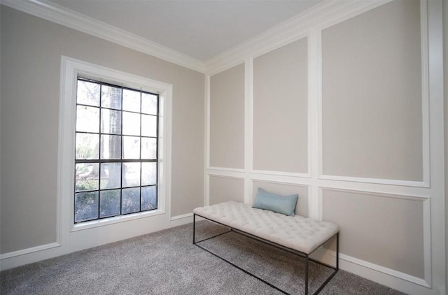 living area featuring ornamental molding and carpet