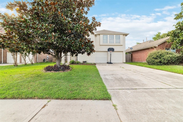 view of front of house with a front yard and a garage