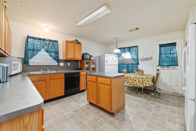 kitchen with sink, decorative light fixtures, a center island, white appliances, and tasteful backsplash