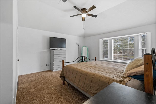 carpeted bedroom with vaulted ceiling and ceiling fan