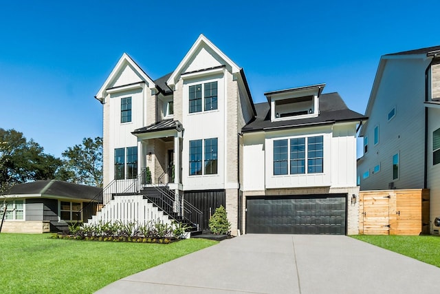 view of front of home featuring a front lawn and a garage