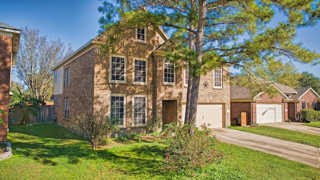 view of front of home with a front yard and a garage