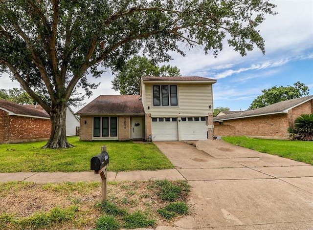 view of property featuring a garage and a front lawn