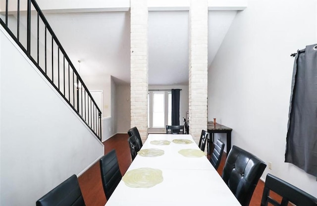 dining space featuring decorative columns