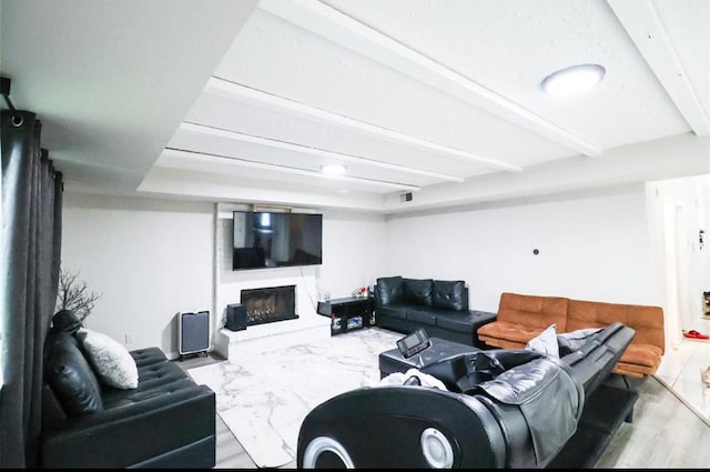 living room with beamed ceiling