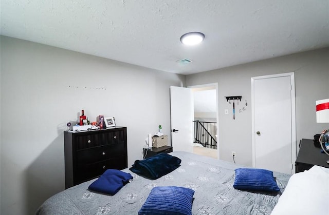 bedroom featuring a textured ceiling