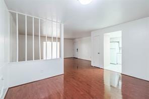 spare room with dark hardwood / wood-style floors