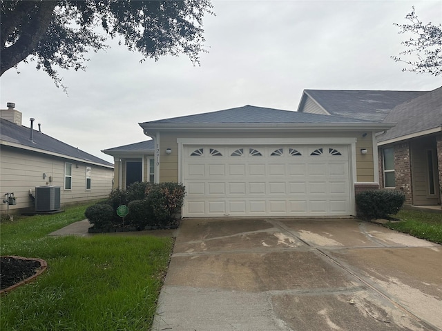 ranch-style home with a garage and cooling unit