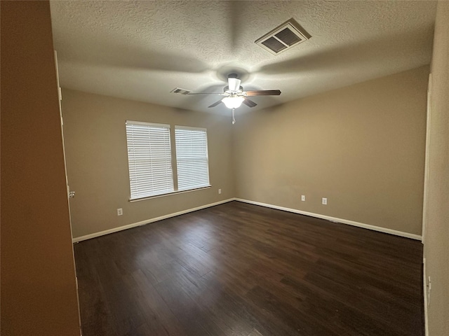 unfurnished room featuring a textured ceiling, ceiling fan, and dark hardwood / wood-style floors