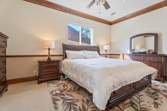 bedroom featuring ornamental molding, ceiling fan, and light carpet