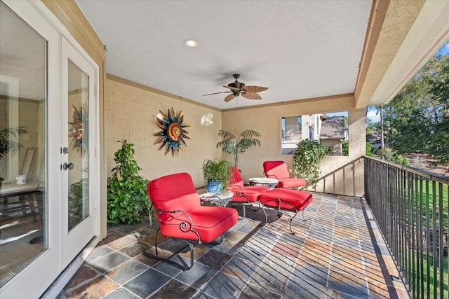 balcony featuring french doors and ceiling fan