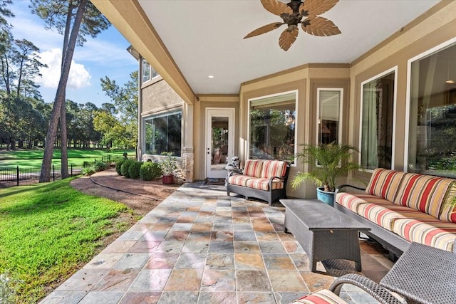 view of patio / terrace with ceiling fan and outdoor lounge area