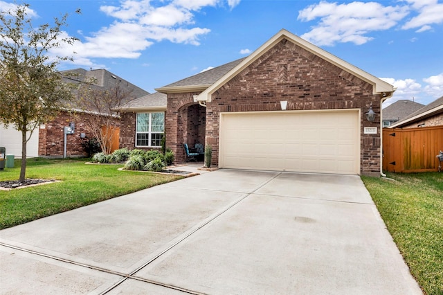 view of front of property featuring a front lawn and a garage