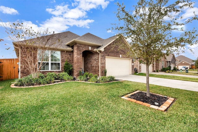 view of front of property with a garage and a front yard